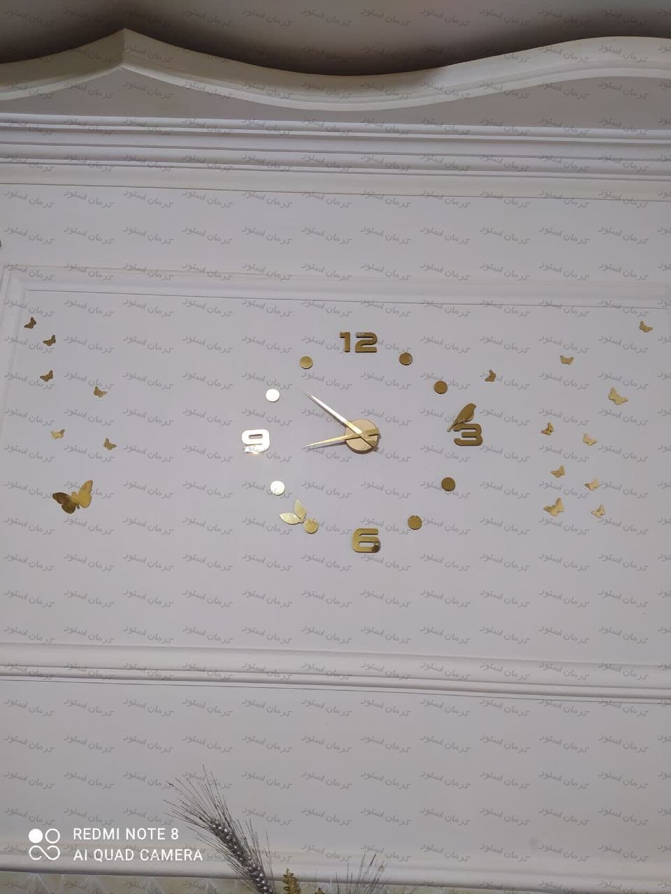 نمونه نصب شده ساعت دیواری طرح پرنده طلایی
